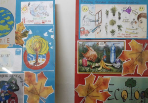 Dwie antyramy z pracami rysunkowymi i malarskimi uczniów o tematyce ekologicznej.