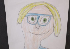 Praca indywidualna uczestnika świetlicy - portret nauczyciela (technika rysunkowa)