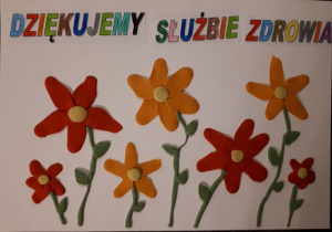 Kwiaty i kolorowy napis: "Dziękujmy służbie zdrowia".