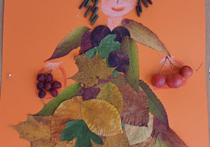 Praca indywidualna uczestnika konkursu "Pani Jesień liściem malowana" (portret rysowany i ozdobiony liśćmi, owocami)